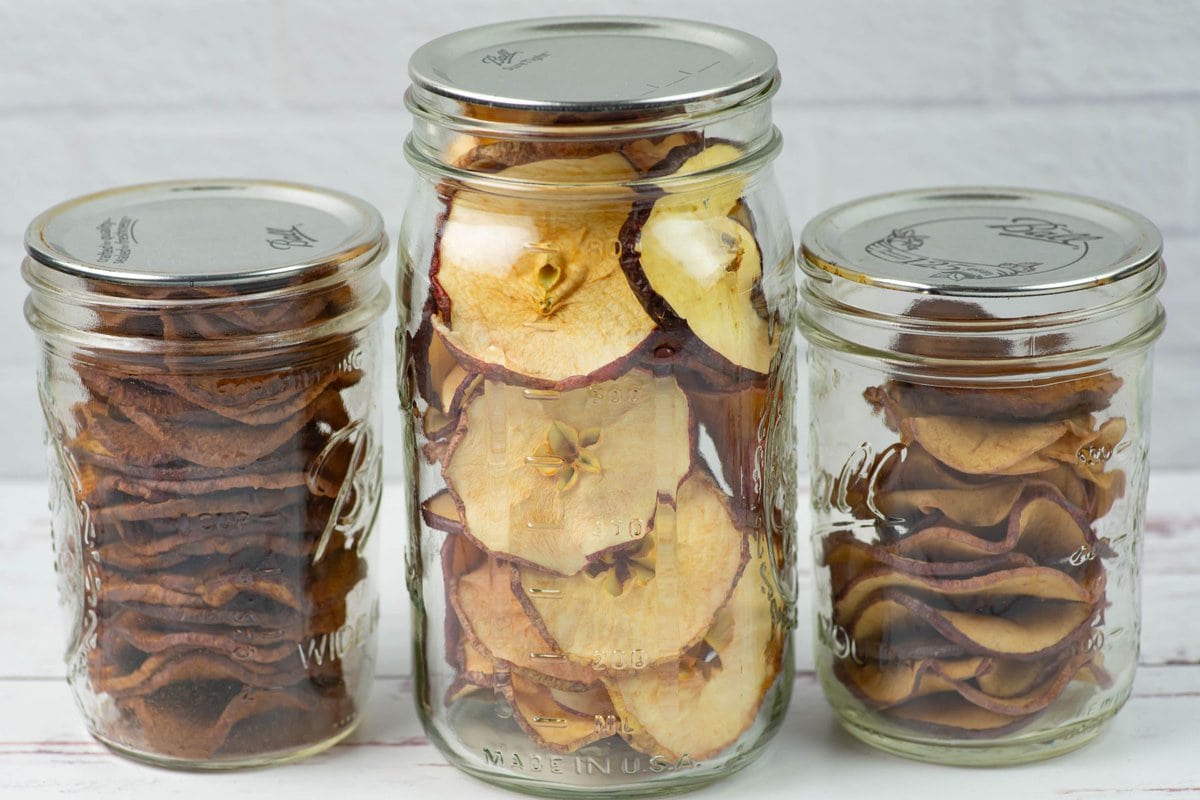 Dried apple slices in vacuum sealed mason jars.