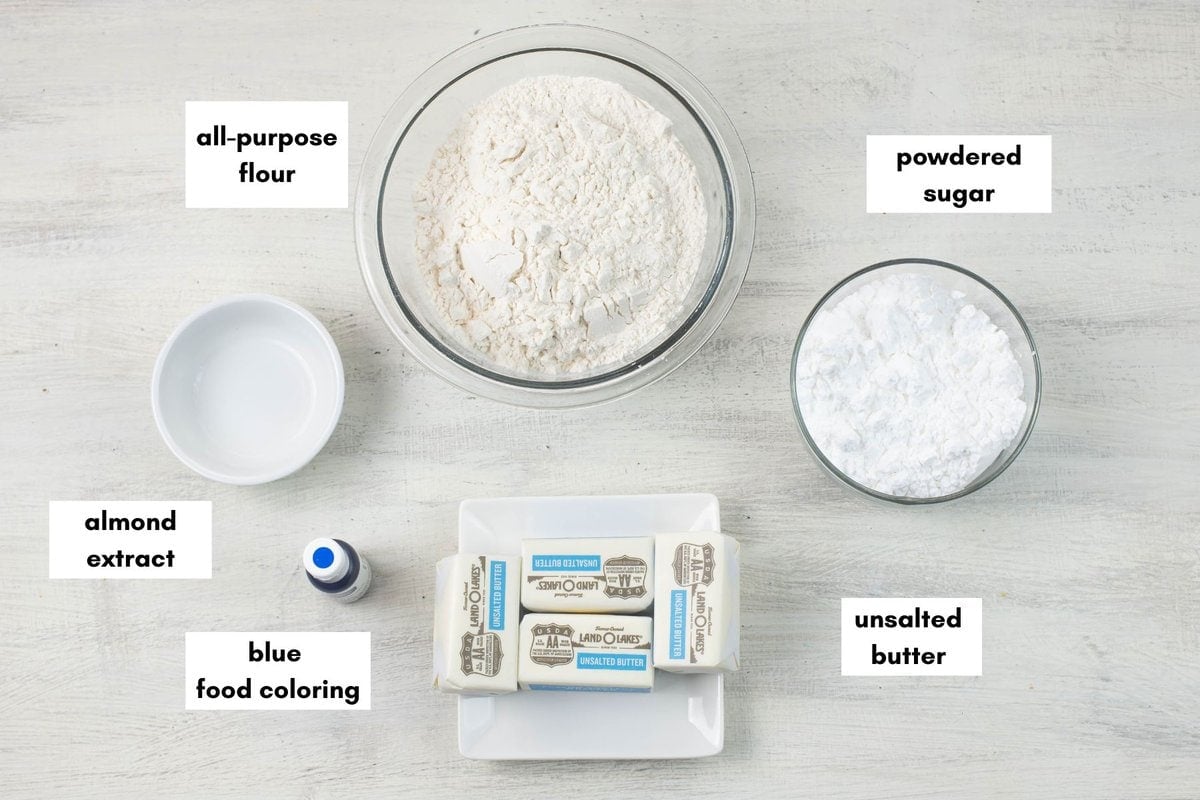 Blue and white cookie ingredients premeasured in bowls.