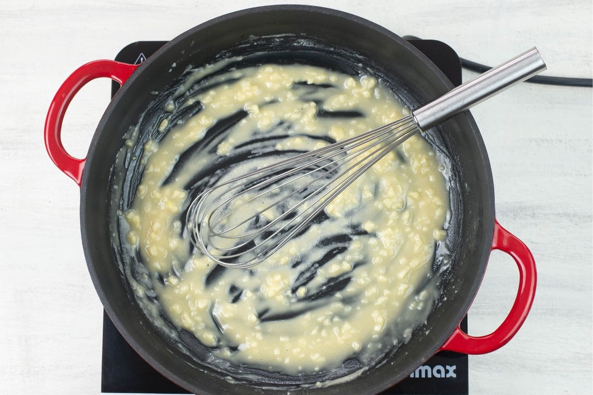 A hot skillet with a thick flour and butter roux cooking.