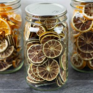 Dehydrated Lime Slices in quart mason jars.