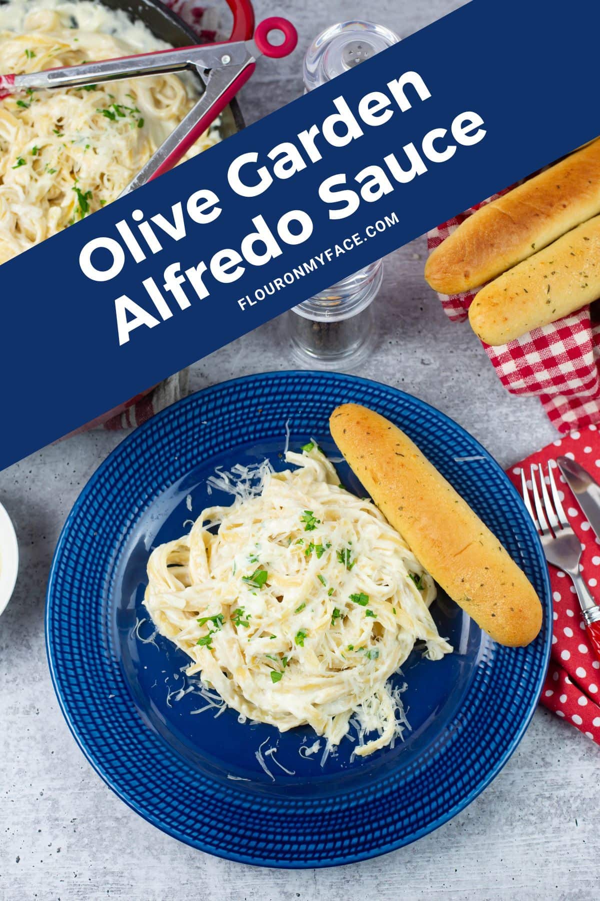 Serving of Olive Garden Alfredo Sauce with fettuccine pasta on a dinner plate.