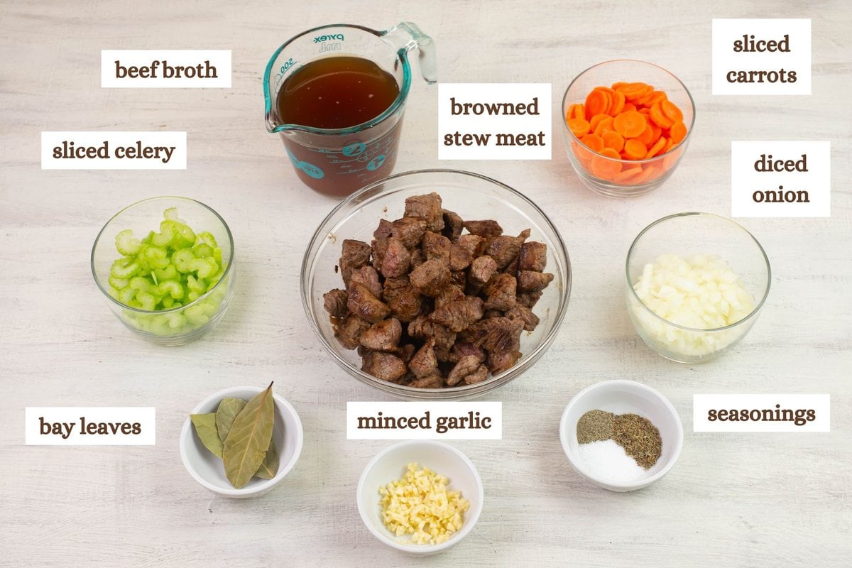 Beef Noodle soup ingredients premeasured in bowls.