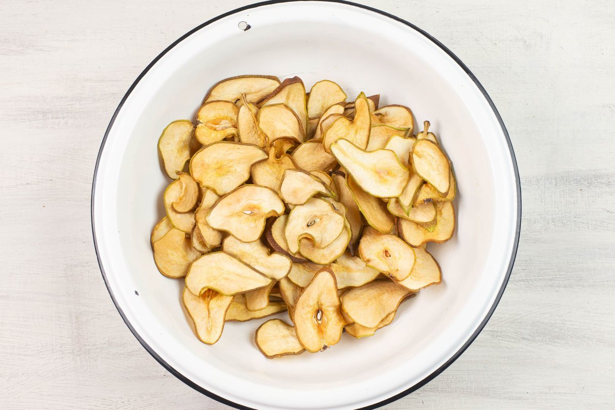 Dried pear slices in a large bowl.