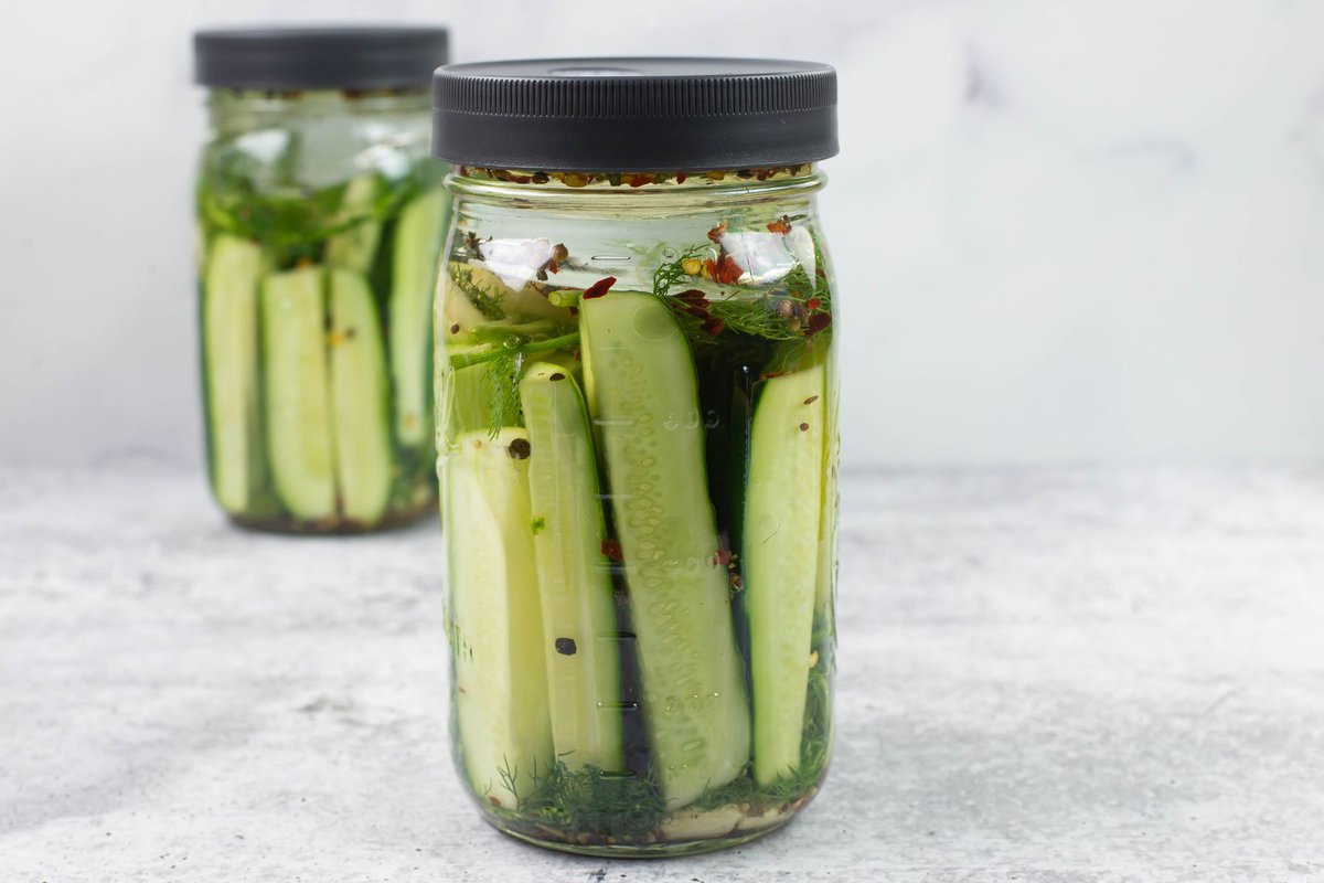Example of a fermenting lid on a jar of cucumbers.