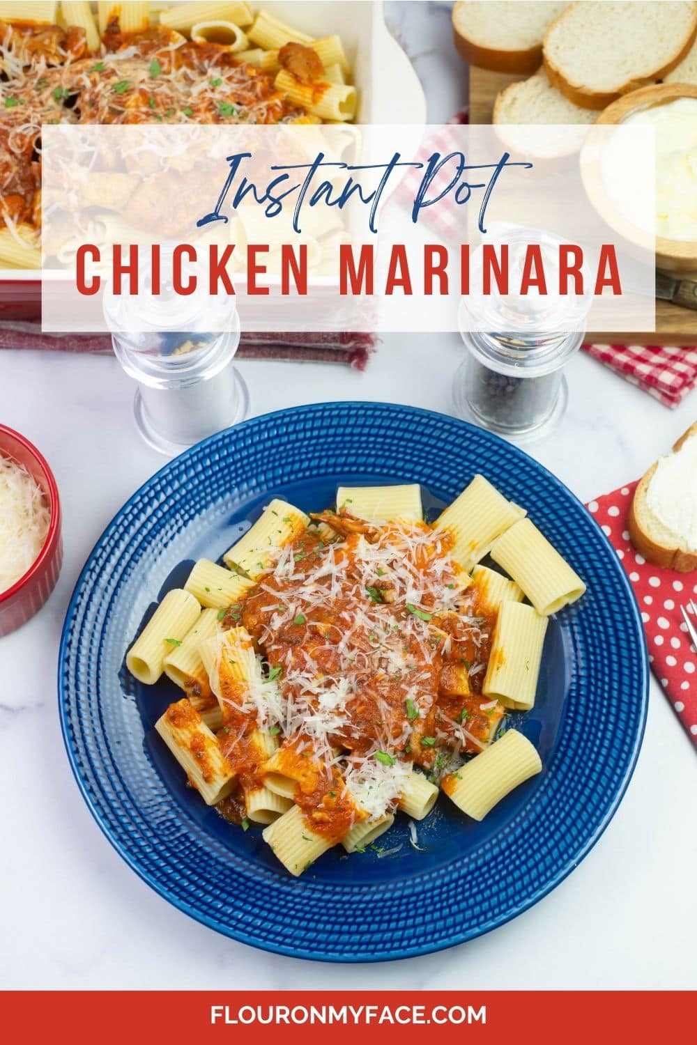 Vertical image of Chicken Marinara served on a plate with sliced bread.