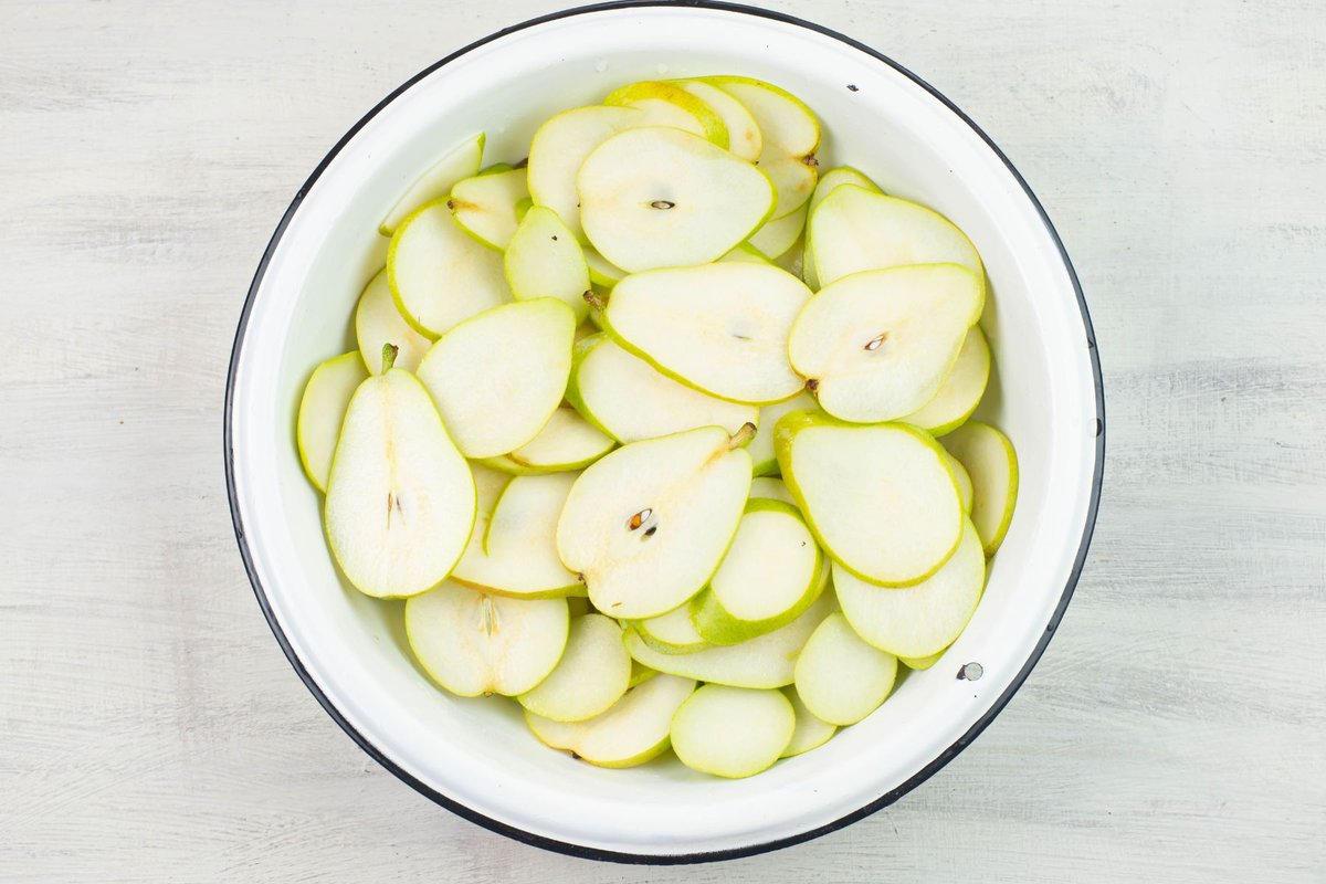 Sliced pears in a large bowl.