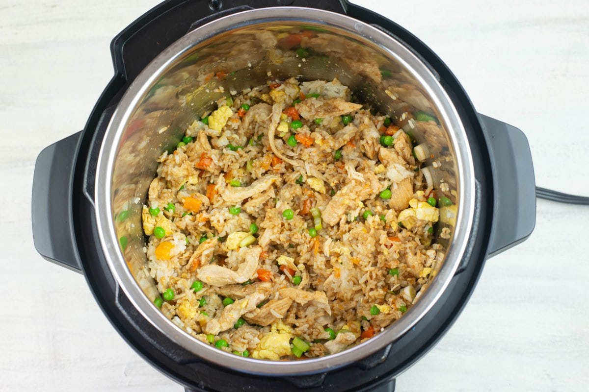 The pressure cooked chicken fried rice in the pot before serving.