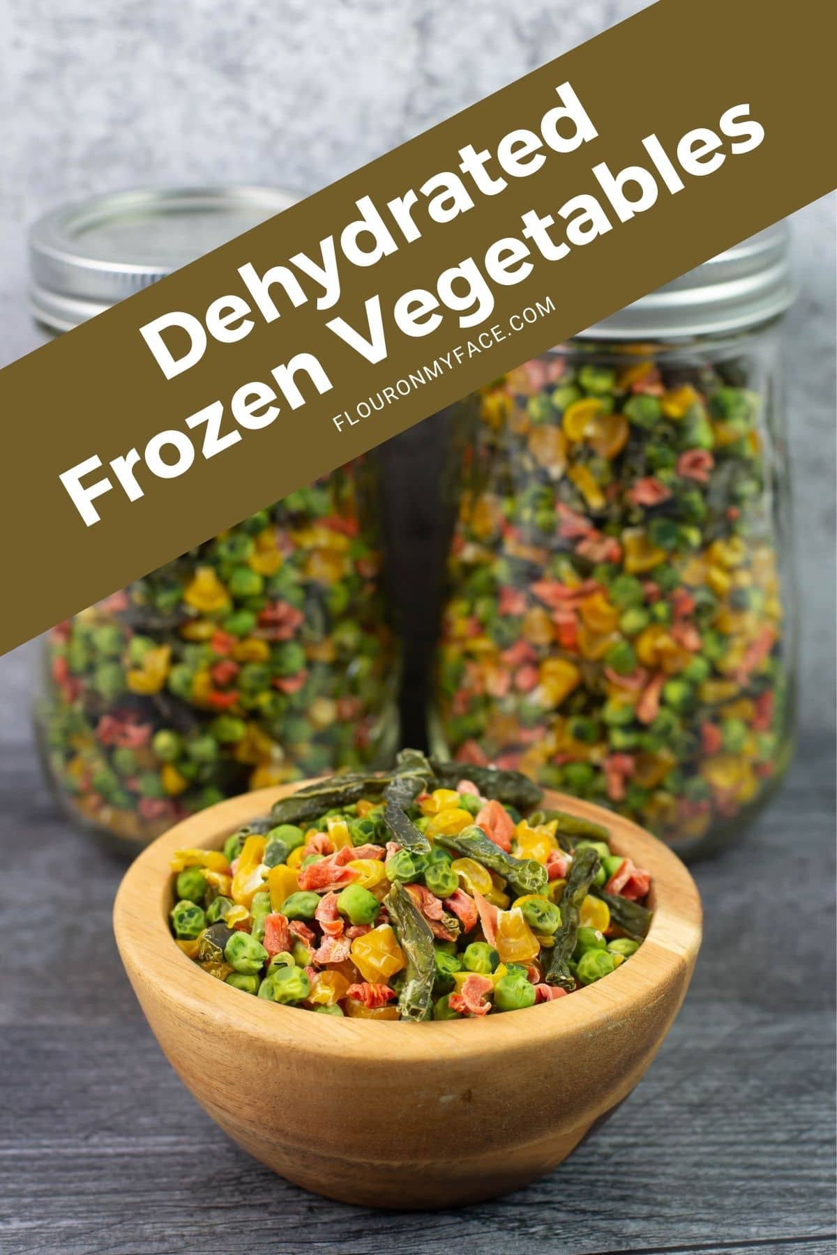 Large vertical image of a bowl of dehydrated mixed frozen vegetables.