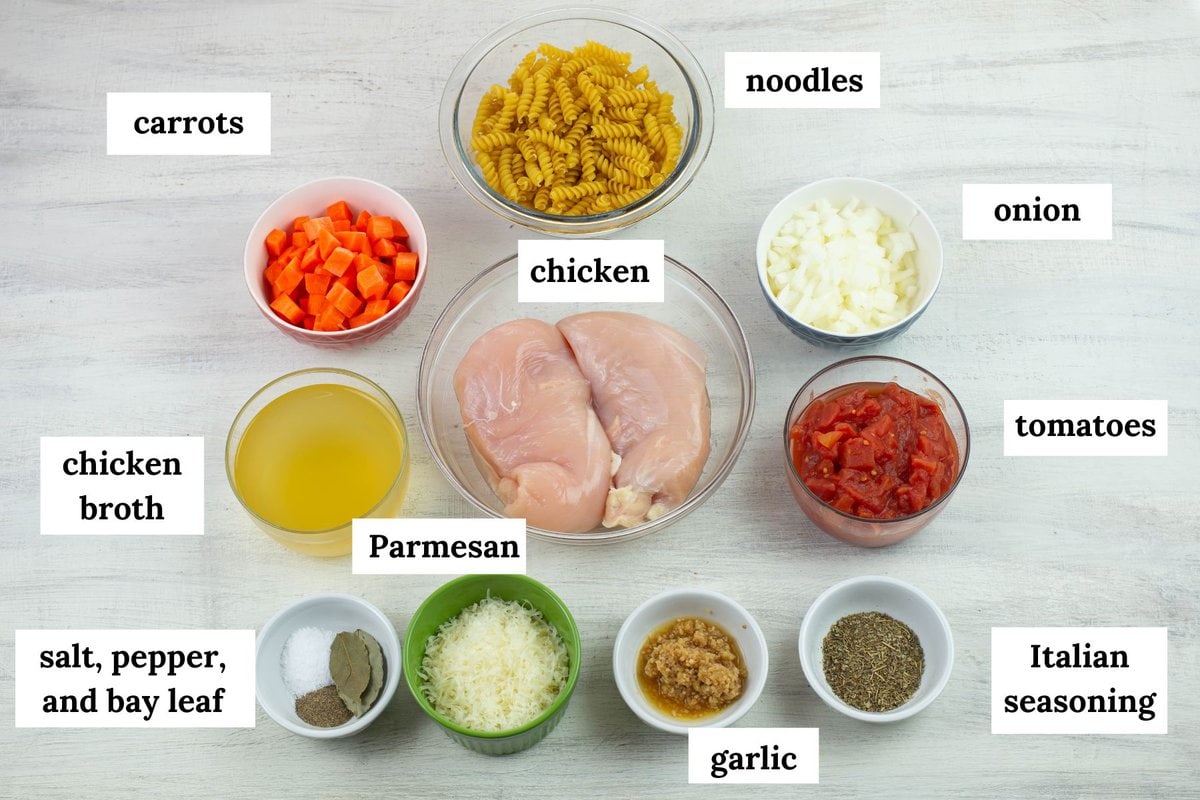Italian chicken soup ingredients premeasured in small bowls.