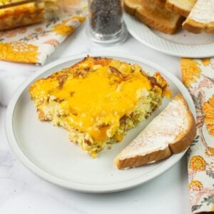 Serving Amish Breakfast Casserole with buttered toast.