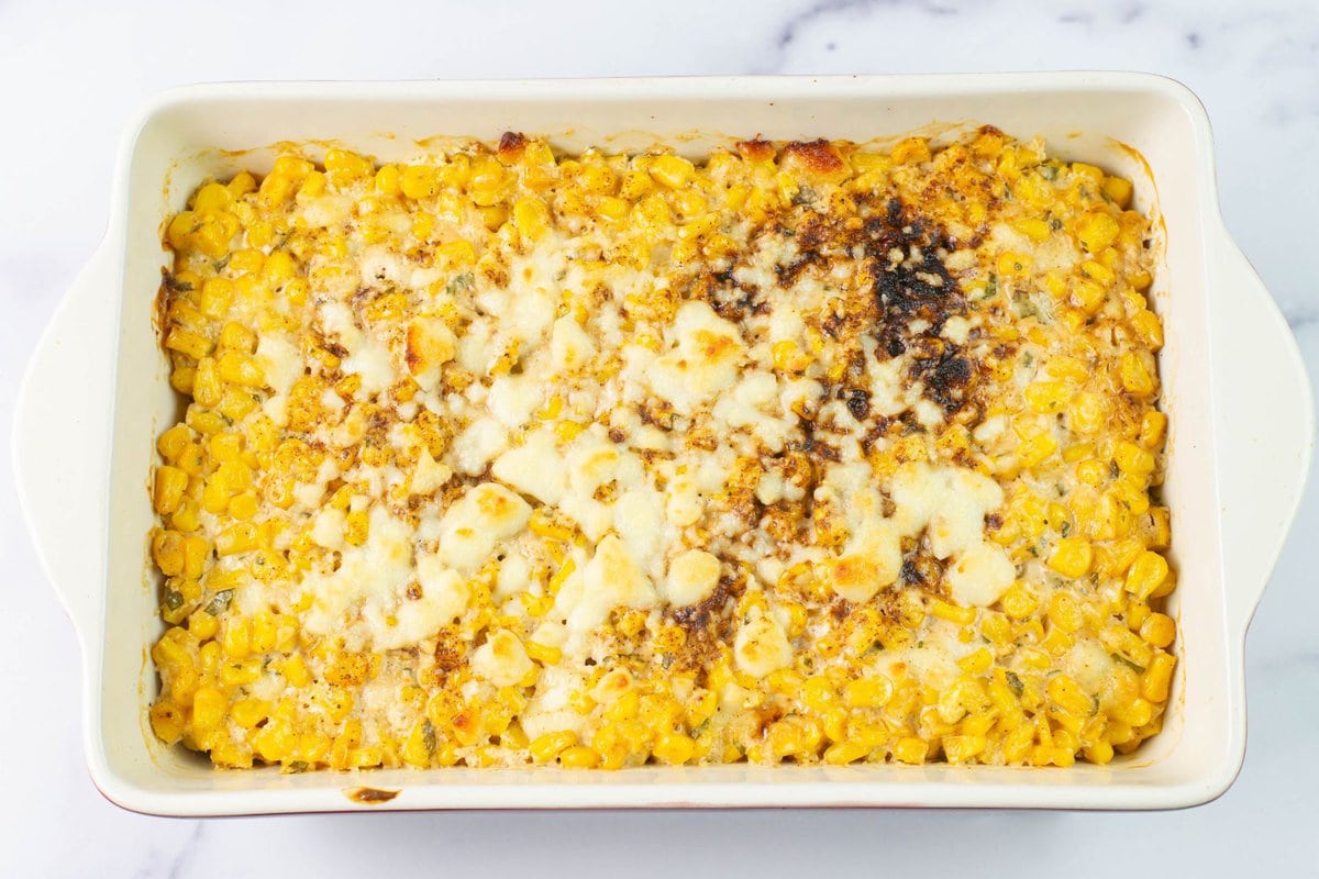 Corn Casserole with Cotija fresh from the oven in a baking pan.