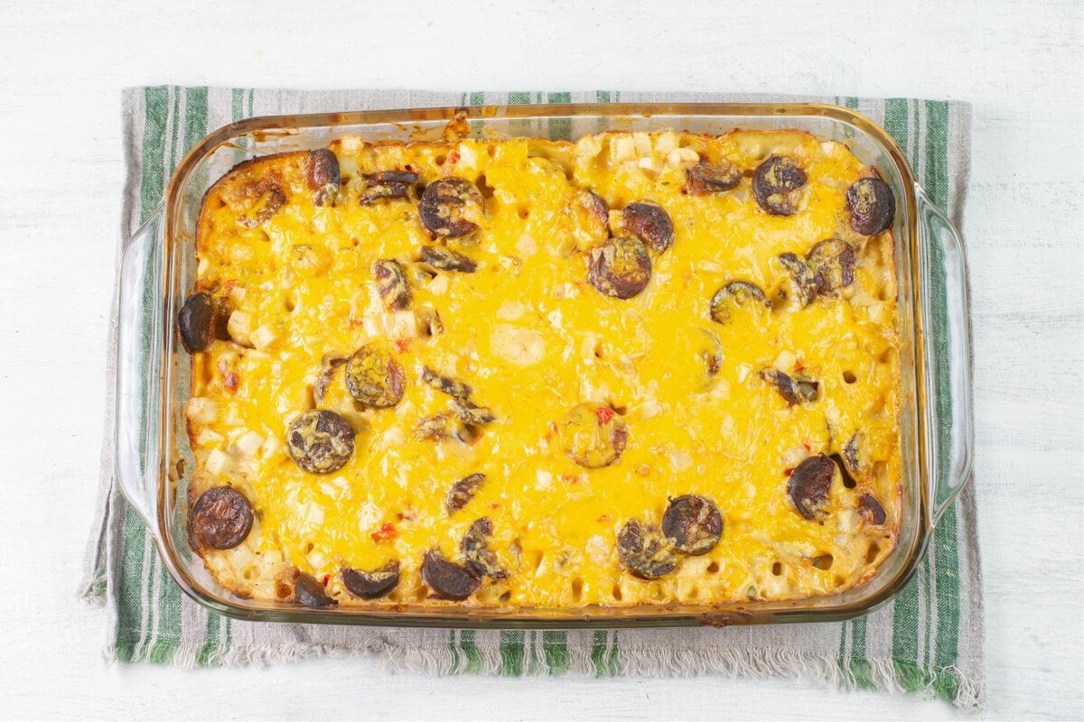 Just baked casserole out of the oven with melted cheese on top.