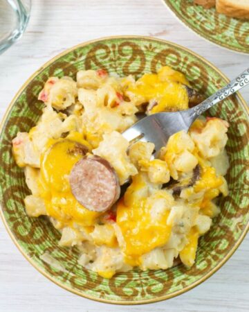 Kielbasa Breakfast Casserole in a bowl served with toast and juice.