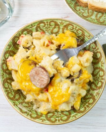 Kielbasa Breakfast Casserole in a bowl served with toast and juice.