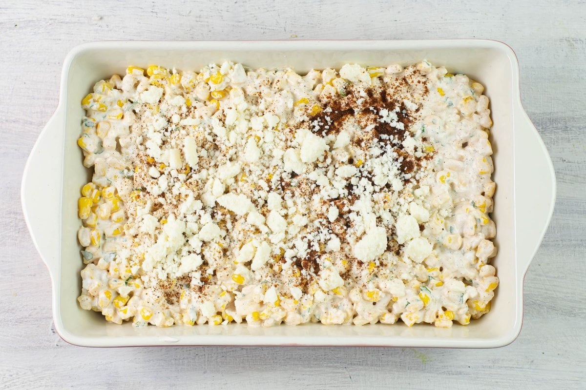 Creamy Elote Bake mixed in a casserole dish before baking.