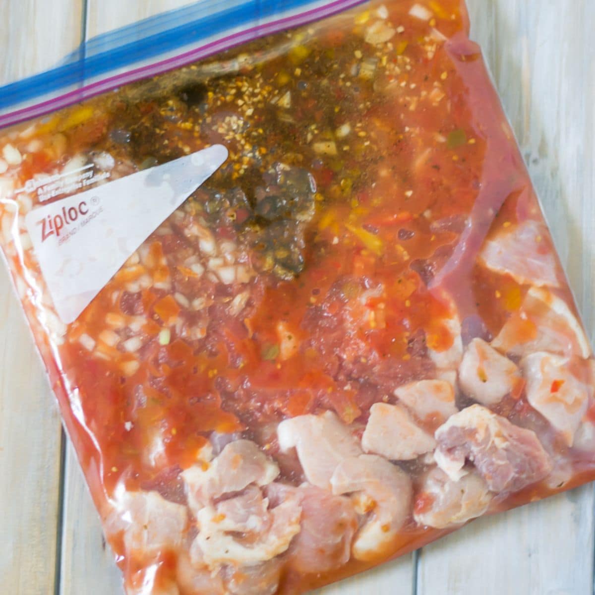 Pork stew in a freezer bag that is made in the slow cooker.