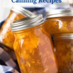 Closeup of a canning jar filled with peach preserves.