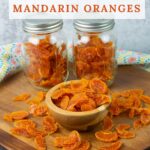 Long vertical image of dehydrated mandarin orange slices.