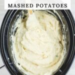 Long vertical image of mashed potatoes in the crock pot.