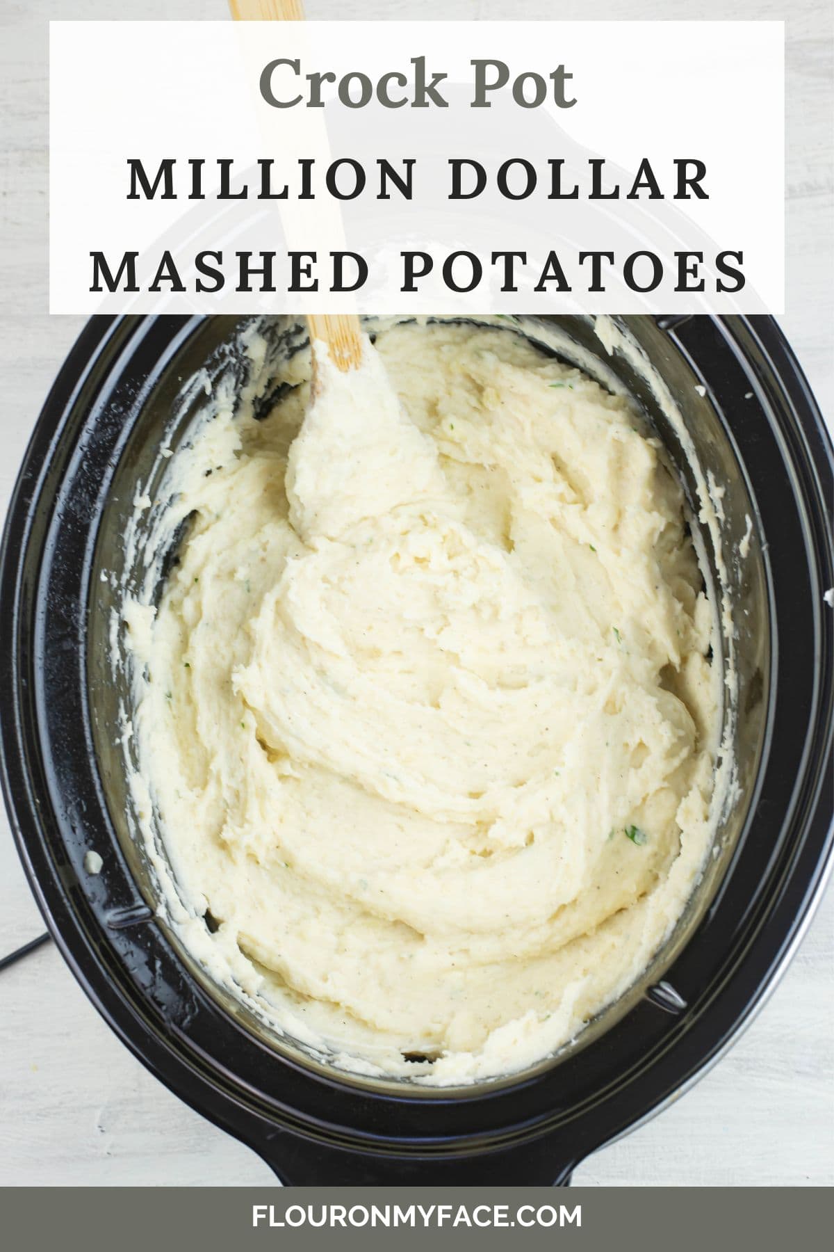 Long vertical image of mashed potatoes in the crock pot.