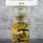 Mason Jars filled with dehydrated vegetables and soup seasoning blend.