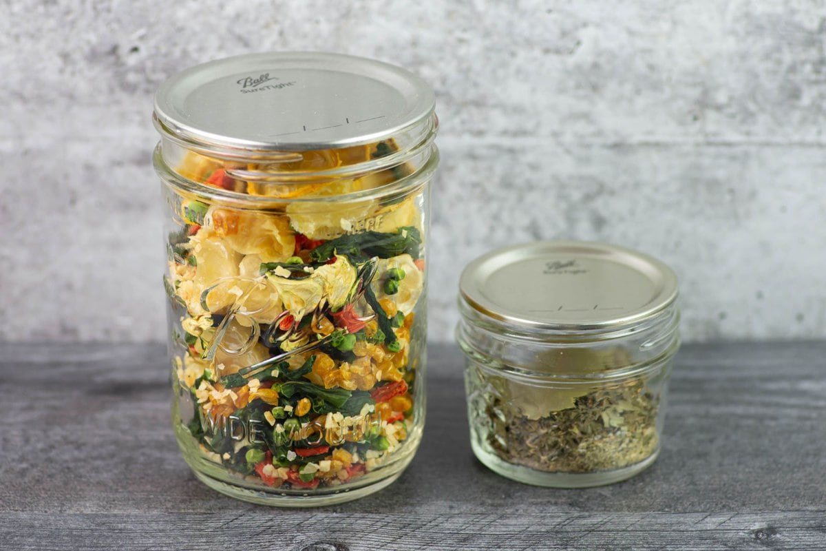 Dry vegetable soup mix and seasonings in mason jars.