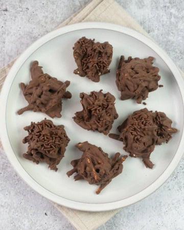 Chocolate Haystack Cookies on a white plate.