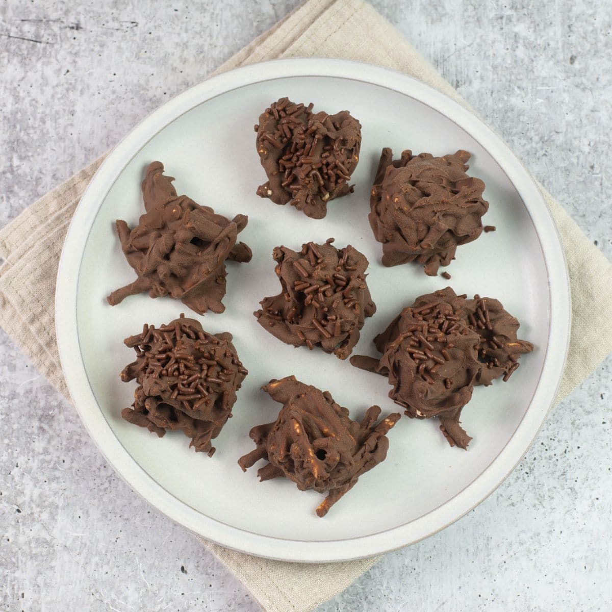 Chocolate Haystack Cookies on a white plate.