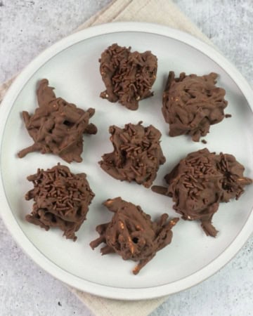 Chocolate Haystack Cookies on a white plate.