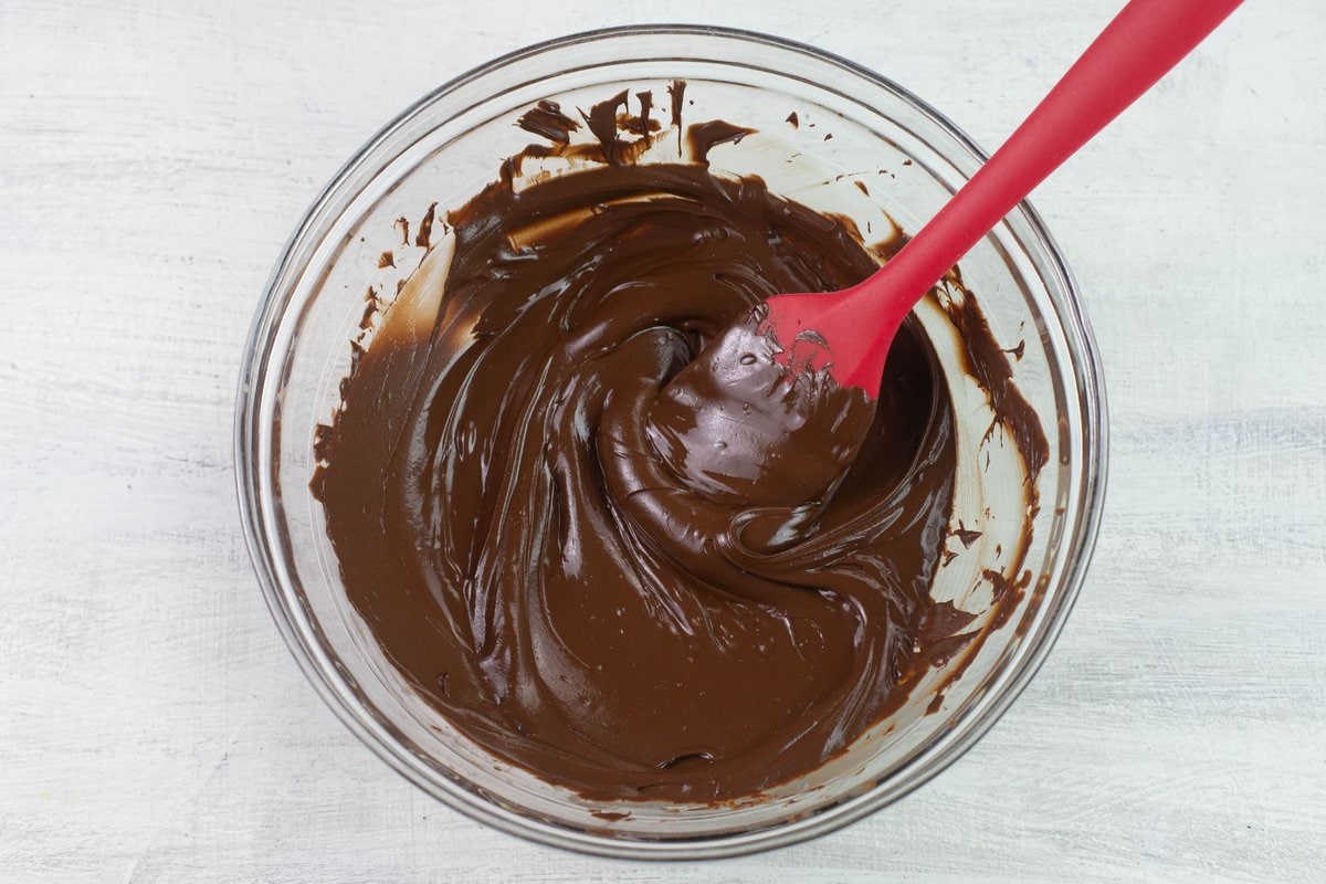 Melted semi sweet chocolate in a glass bowl.