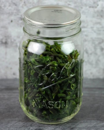 Dried green beans in a mason jar.