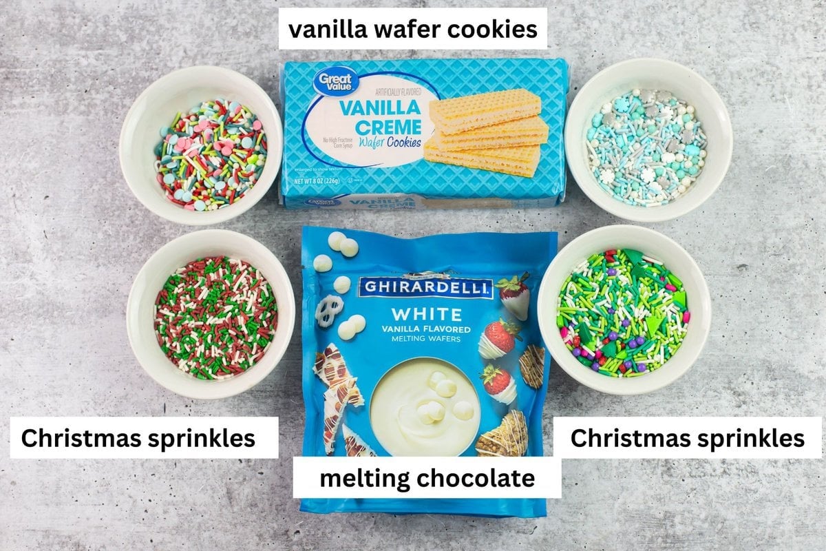 Vanilla wafer cookies, melting chocolate and Christmas sprinkles used to make no bake cookies.