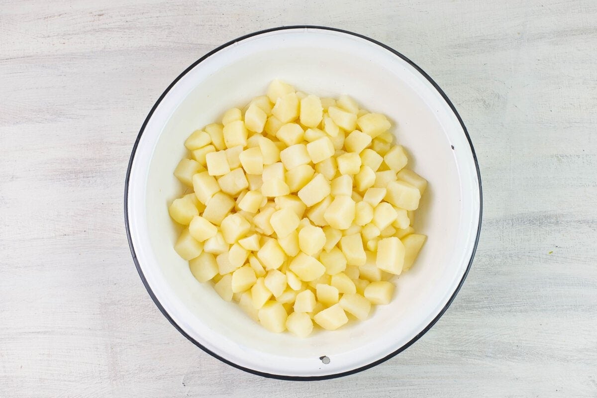 Blanched cubed russets in a bowl.