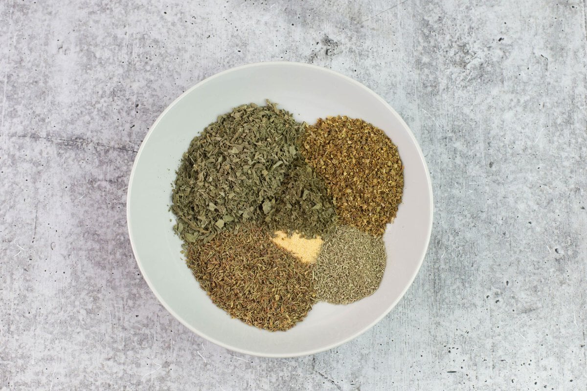 Pre-measured herbs in a bowl.