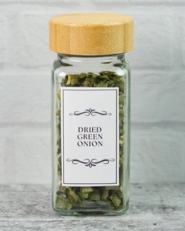 Dried scallion tops in a labels spice jar.