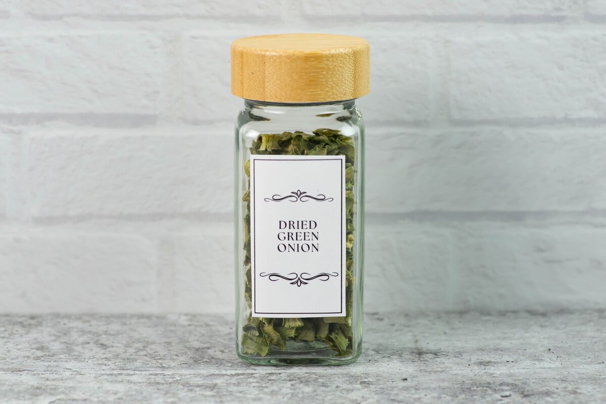 Dried scallion tops in a labels spice jar.