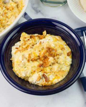 Million Dollar Chicken Casserole served in a blue bowl.