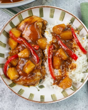 Hawaiian bbq chicken with pineapple served over rice in a bowl.