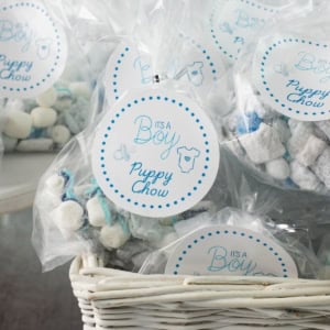 Its a boy Puppy Chow treat labels attached to bags of puppy chow.