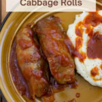Large image slow cooker stuffed cabbage rolls on a plate.