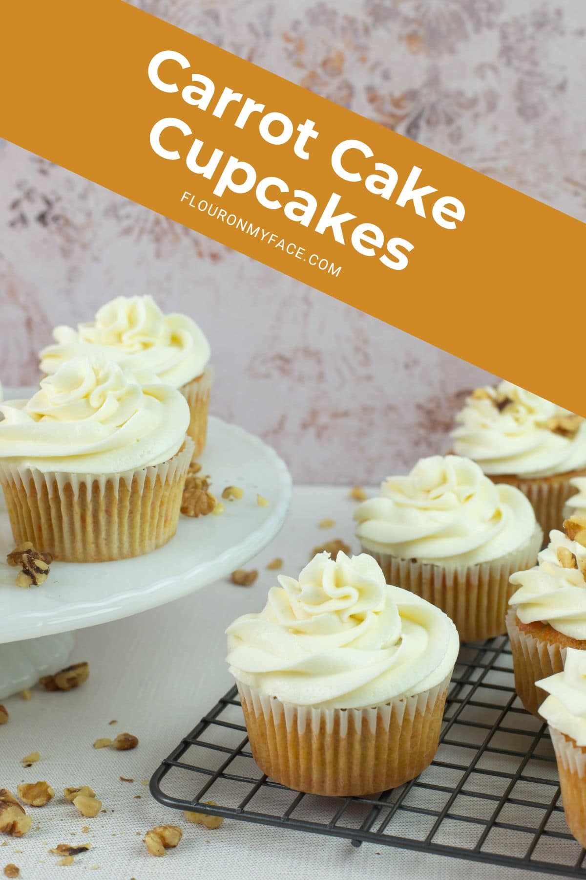 Long image of carrot cake cupcakes on a table top.