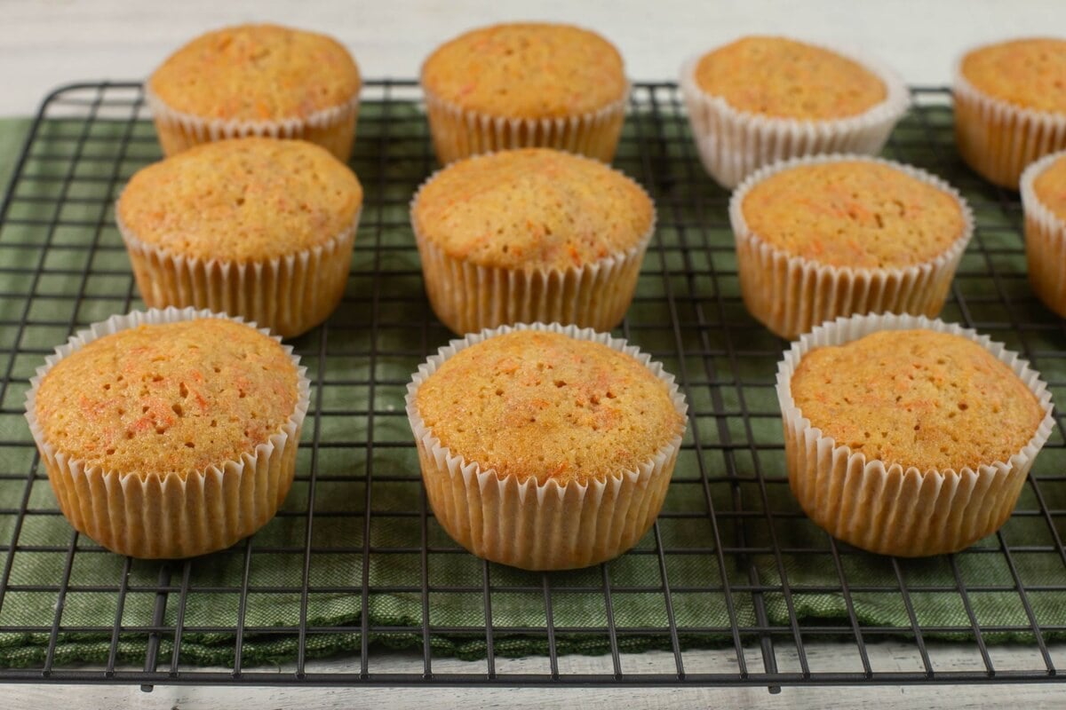 Cup cakes on a cooling rack.