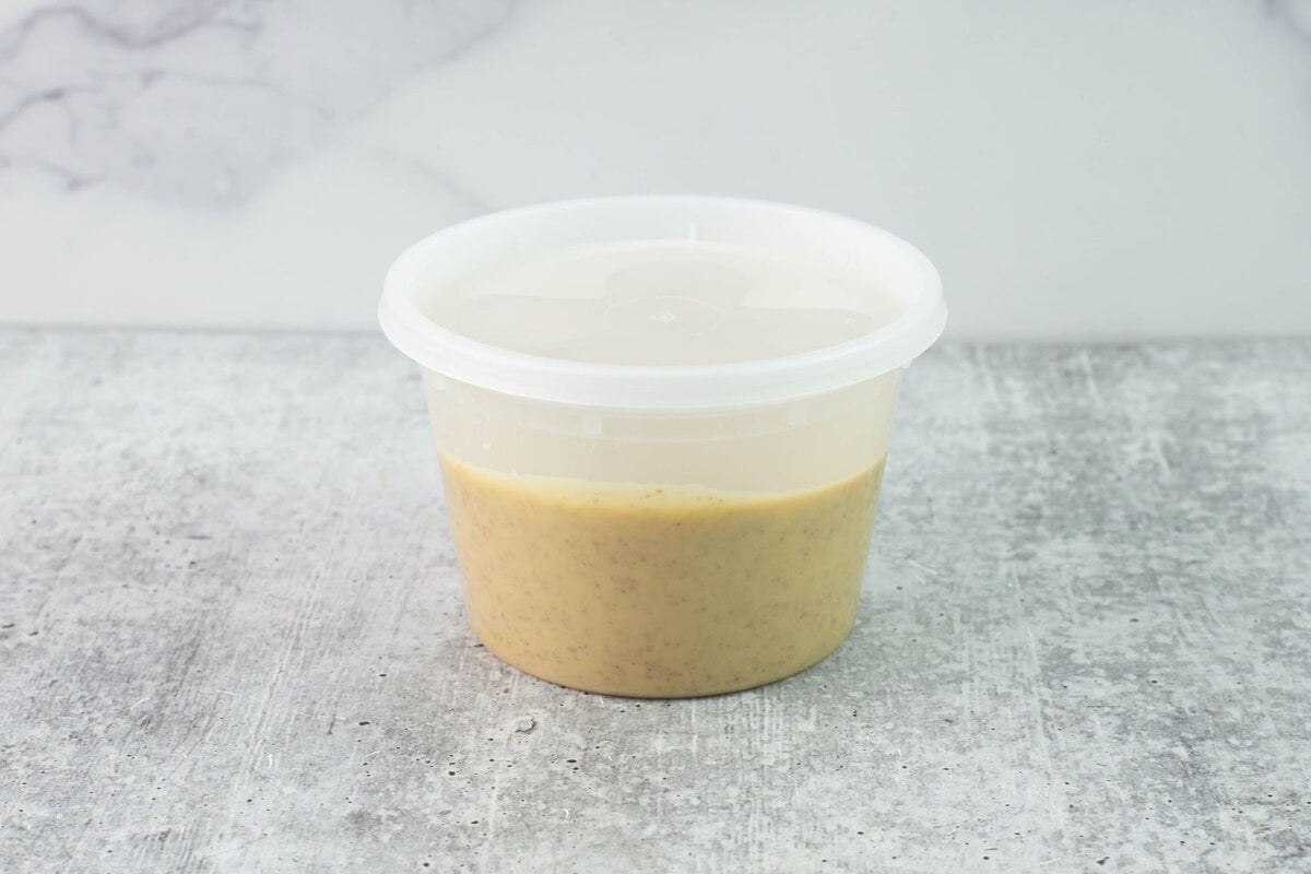 Plastic food container filled with the recipe for storage.