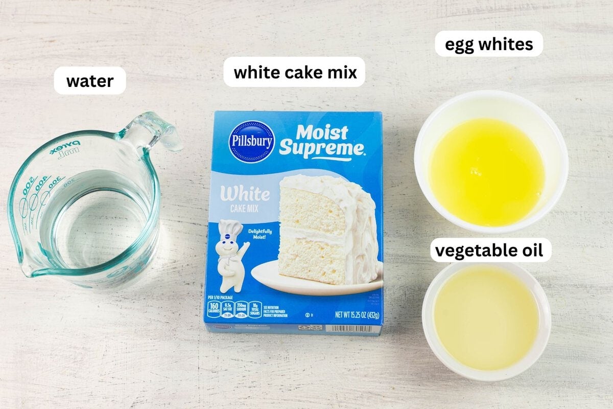 Poke Cake ingredients: boxed cake mix, egg whites, oil and milk.