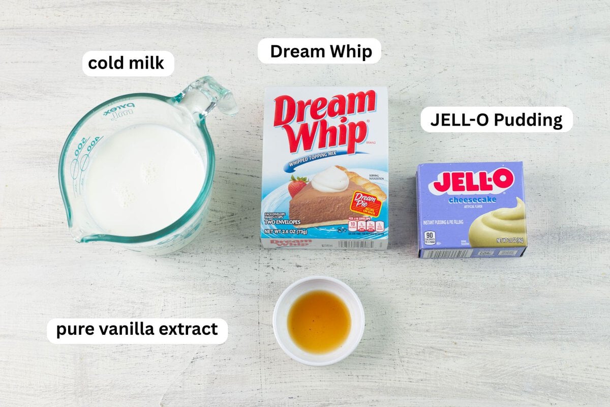 Poke Cake frosting ingredients: Milk, Dream Whip, boxed JELL-O pudding mix, and vanilla extract.