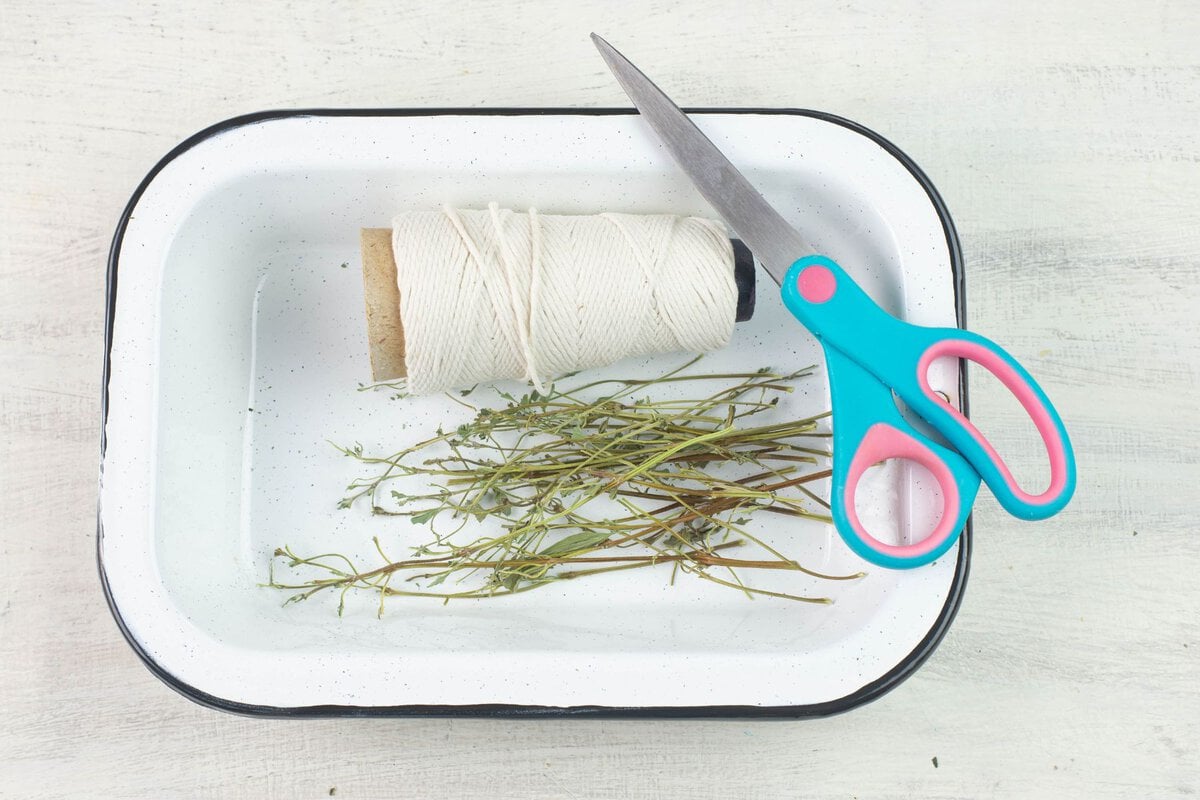 Supplies needed to make dried herb bundles.