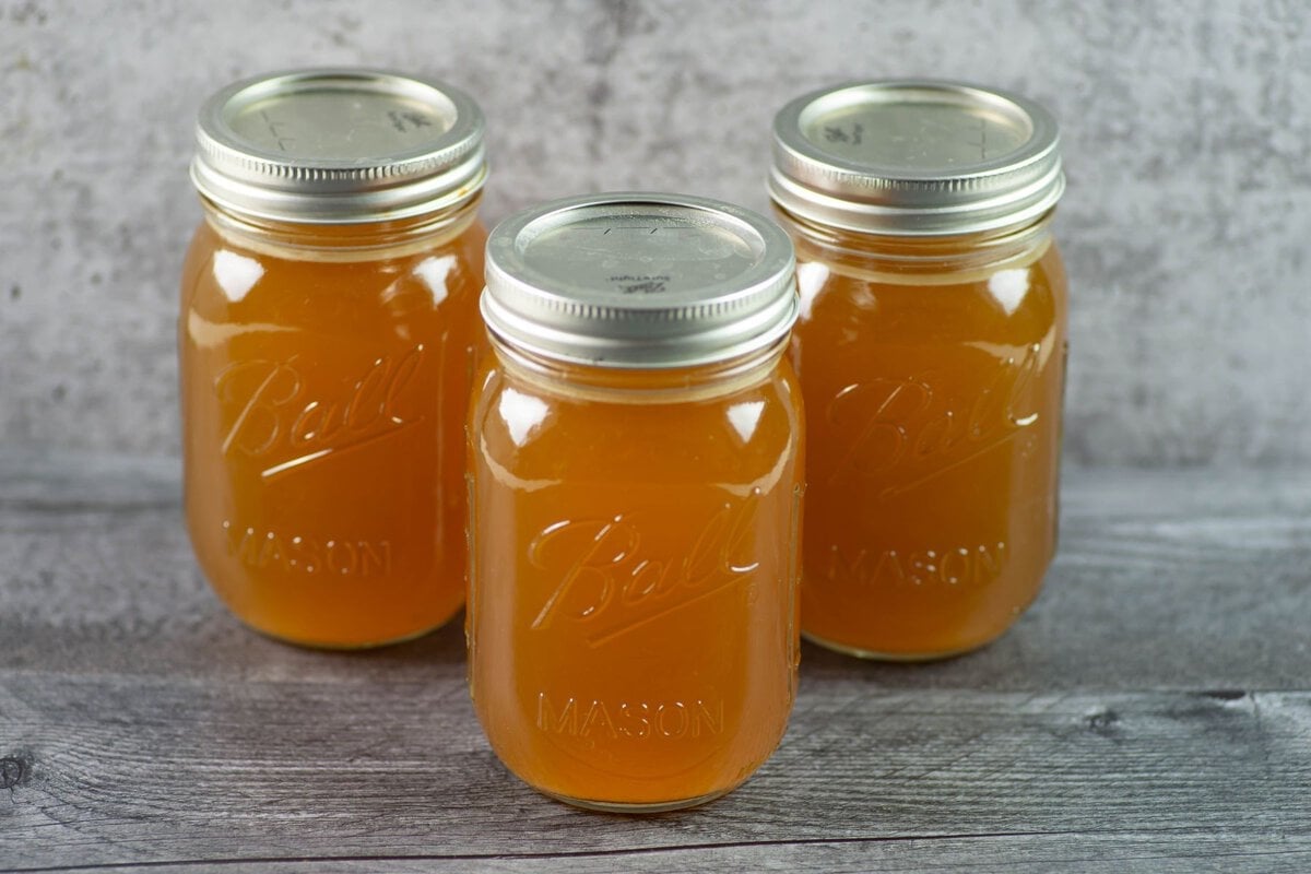 3 quart mason jars filled with homemade broth.