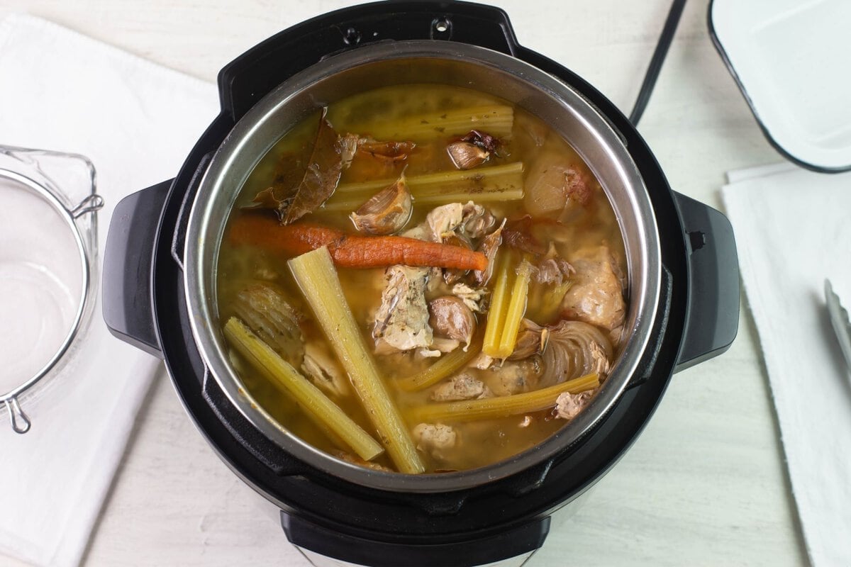 Overhead of cooked turkey broth ingredients.